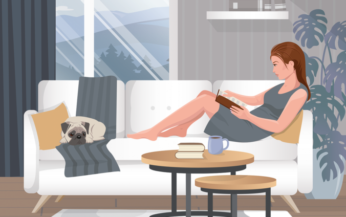 Reading a book on a sofa